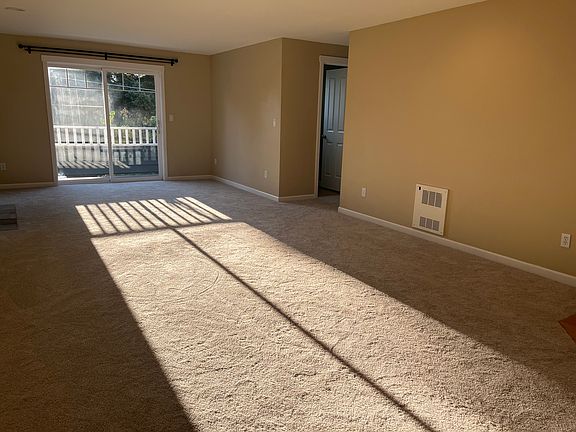 living space with fireplace and balcony