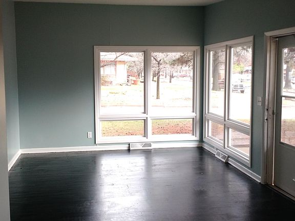 Living room - painted wood floors and pretty windows.