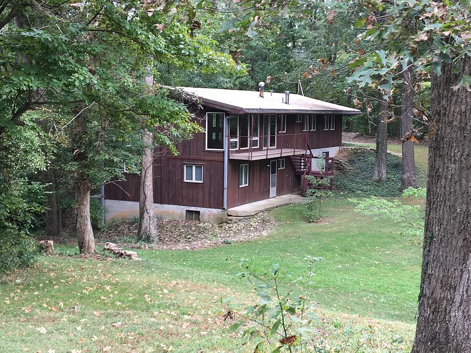 House nestled in woods.
