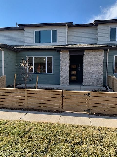 The front of the townhome. Outside the fence is maintained by the HOA. Tenant maintains landscape inside the fence. It is fully landscaped and has drip irrigation.
