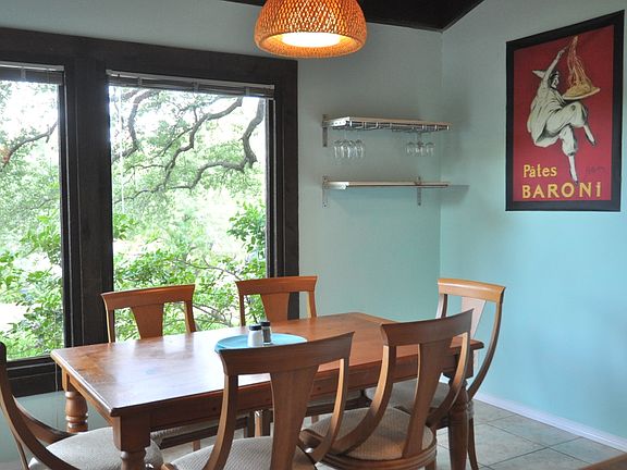 Vaulted ceiling and wall of windows in dining area