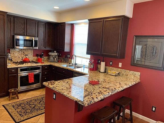 Updated Kitchen with Granite Counters and stainless steel appliances.