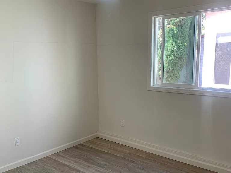 Overhead fan/light and large window provide airflow and plenty of lighting.
