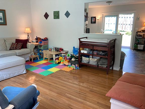 Living area on first floor with hardwood floors