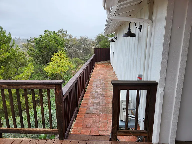Brick path entrance provides room for bar-b-que, and garden.