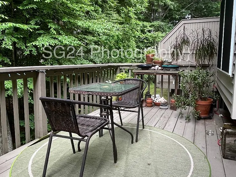View of deck off living room Summer time