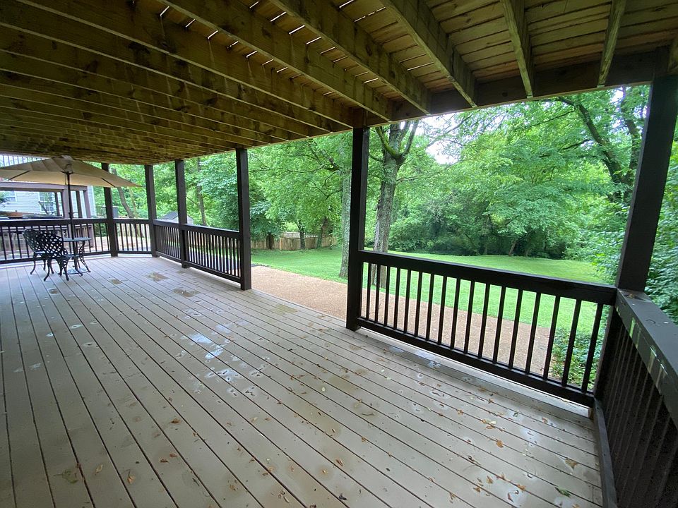 Large private deck off kitchen overlooking a Tranquil backyard