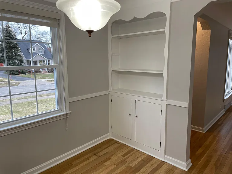 Dining room w/ built-in cabinets