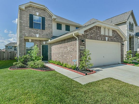 Another view of this nice house with landscaping.