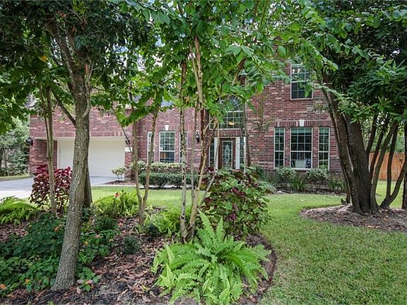 Nicely landscaped yard with sprinkler system.