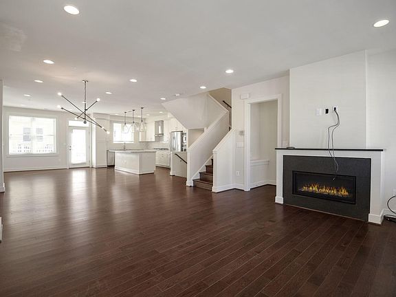 Open concept main floor with kitchen, family room, dining room and living room