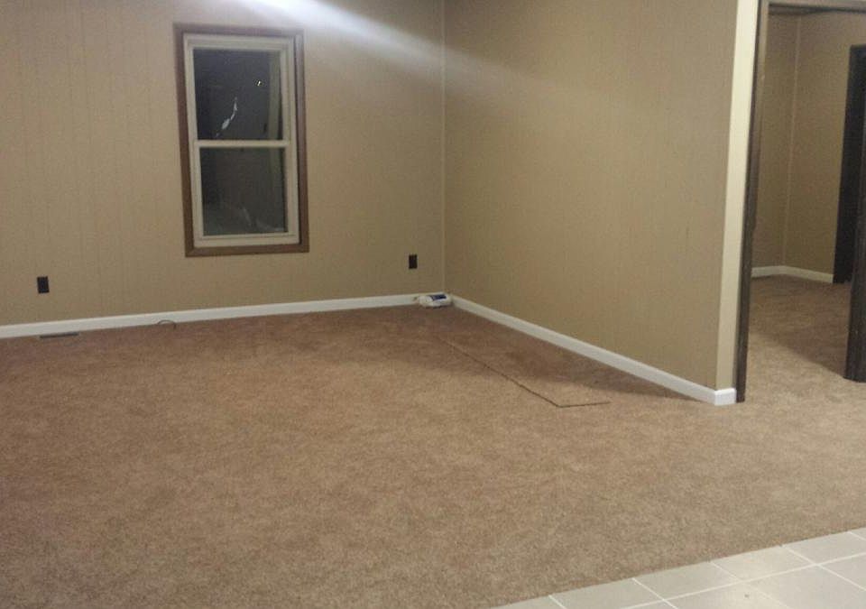 New carpeting. Open floor plan for living and kitchen area.
