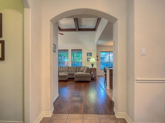A large foyer and bright living area welcomes any visitors.