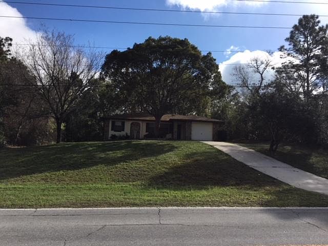 Front yard, house sits nice and high