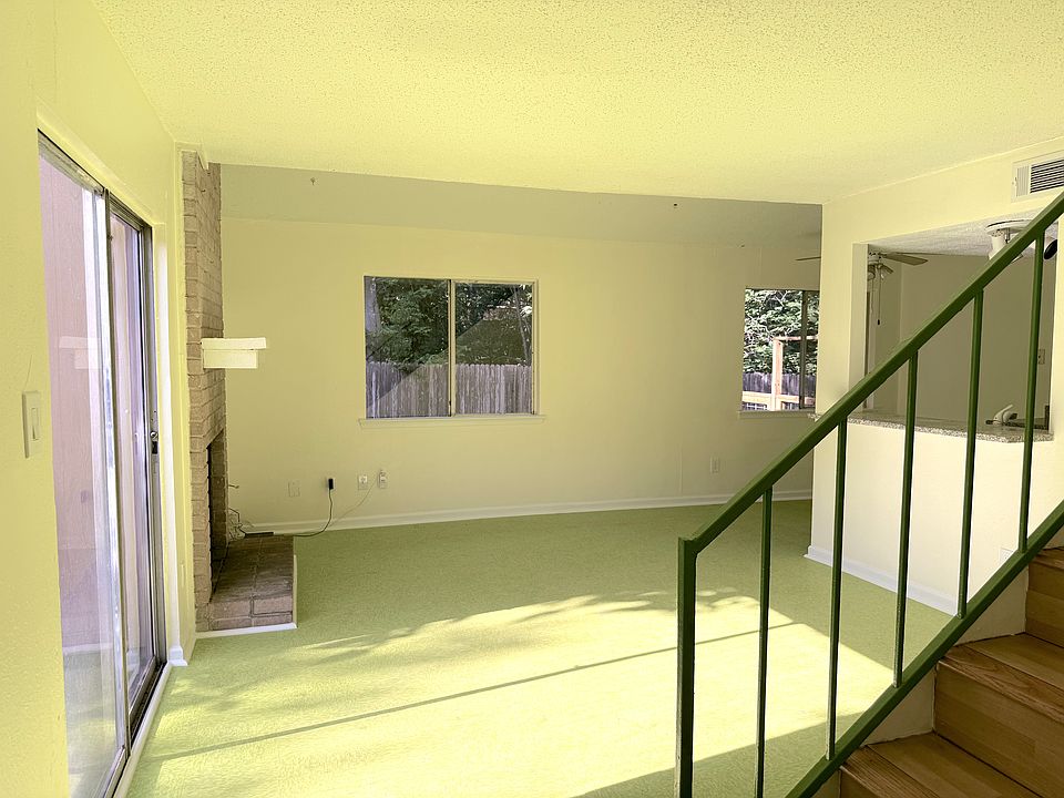 Spacious Livingroom with fireplace and patio access.