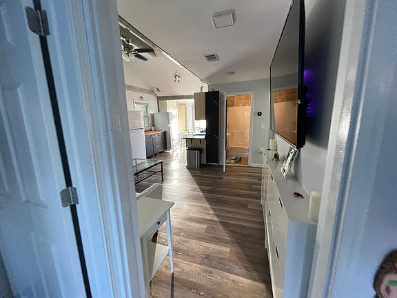 Open concept living, kitchen, dining with 13' vaulted ceiling in living room!