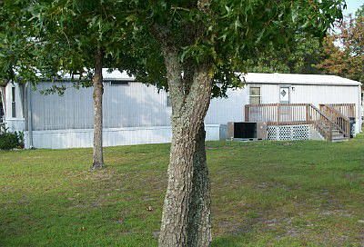 Back with deck, large oaks