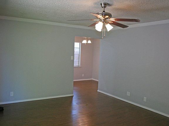 2nd view of the living room into the dining area/kitchen