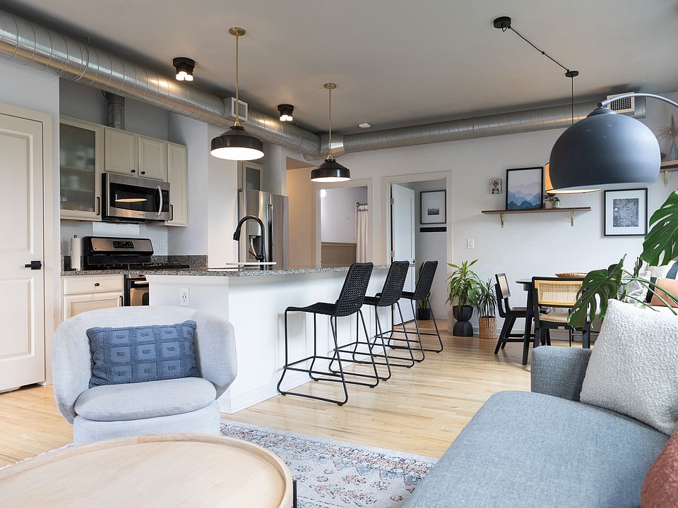 Main Space includes kitchen island open to kitchen table and living room
