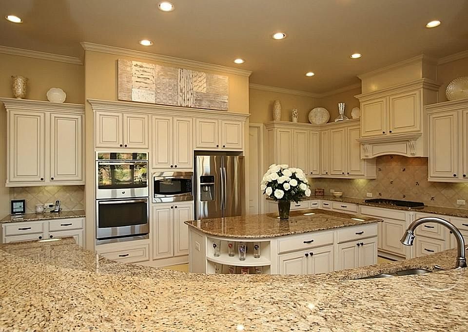 Granite counters & island, stainless appliances, double ovens, under-mount lighting & walk-in pantry!