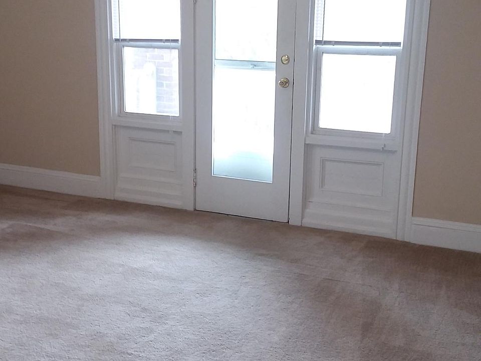 living room with door to front balcony