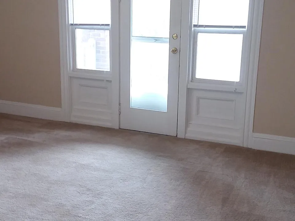 living room with door to front balcony