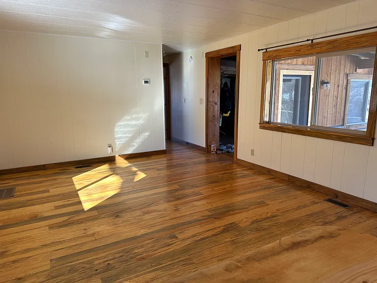 Living or dining room. Sustainably sourced and finished wood floors. Great morning and afternoon light.