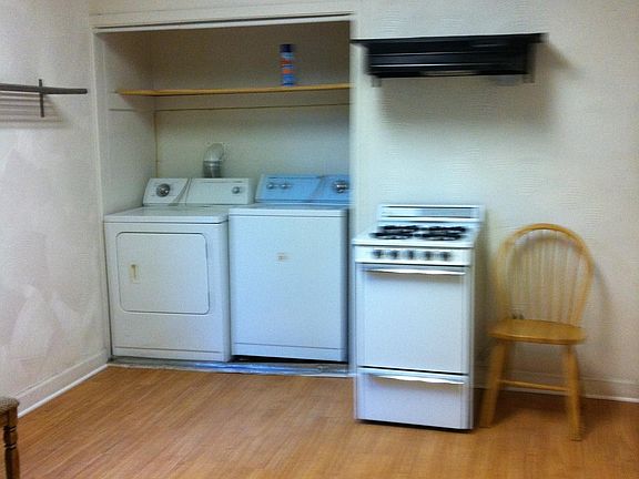 Kitchen has cabinets 