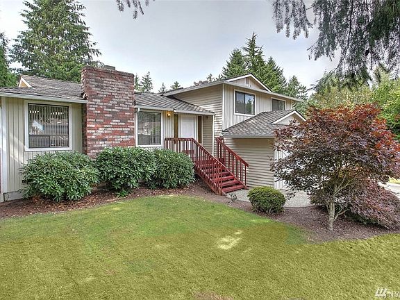 On the upper floor you'll find the master bedroom with more skylights, an ensuite bath with a walk-in shower, and 3 closets as well as two more ample sized guestrooms and an extra large full bath. On the lower floor you'll enjoy the spacious family room with access to the back yard and a sizable utility room with a 1/2 bath along with an additional storage area under the stairs. Enjoy concerts in the park and all Fairwood Greens has to offer: community events, 24/7 security patrol, well-maintained homes, quite streets and award-winning Kent Schools.
