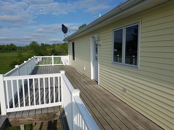 Entrance above rear stairway (behind garage; has both front 