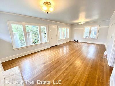 Light-filled upstairs living room with wood floors (throughout entire top floor).