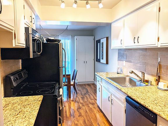 Kitchen with Stainless Steel Appliances, Oversize Sink and Granite Countertops. Lots of Cabinetry.