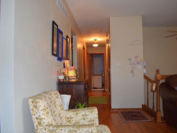 Corridor leading to 3 bedrooms