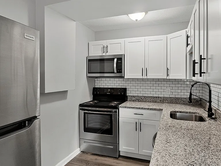 Experience culinary bliss in this sleek, modern kitchen designed for efficiency and style.