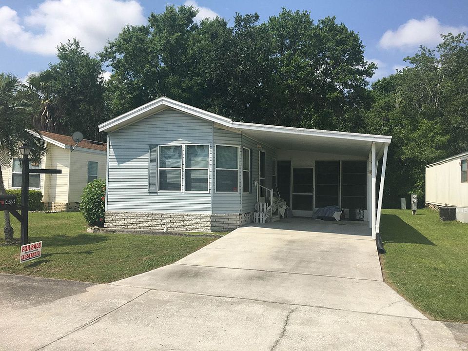 Front of Home with Attached Carport