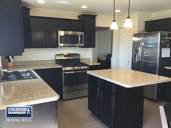 Beautiful kitchen opens to family room. Lots of natural lighting.