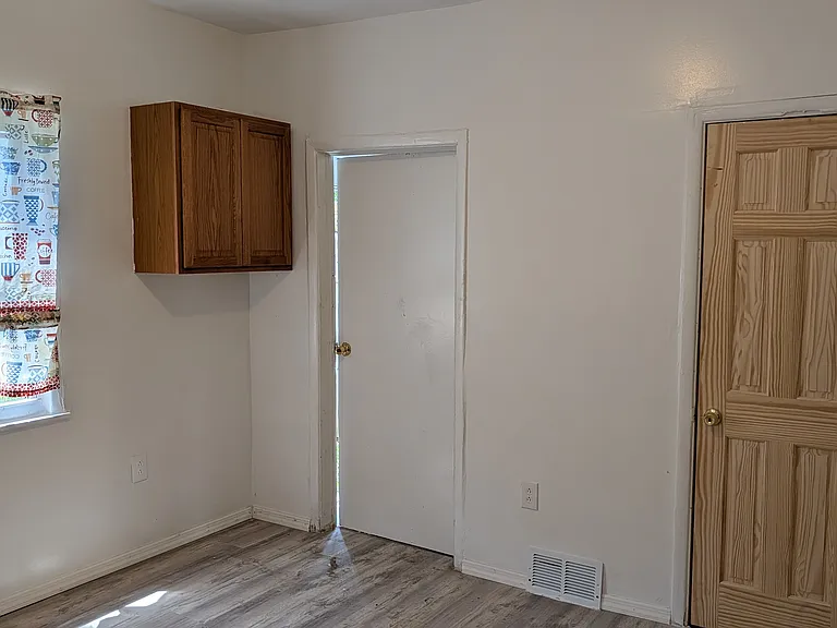 Kitchen and door to basement/fenced in backyard