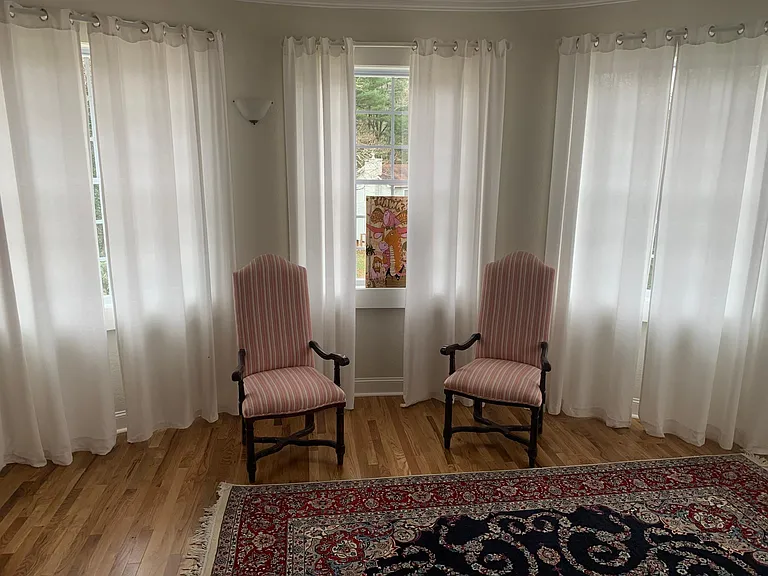 Large bedroom with panoramic windows and king size bed