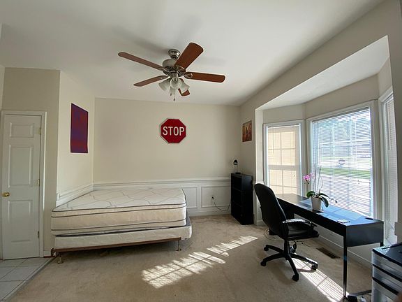 downstairs bedroom - large room, closet, large bay window, fan with light