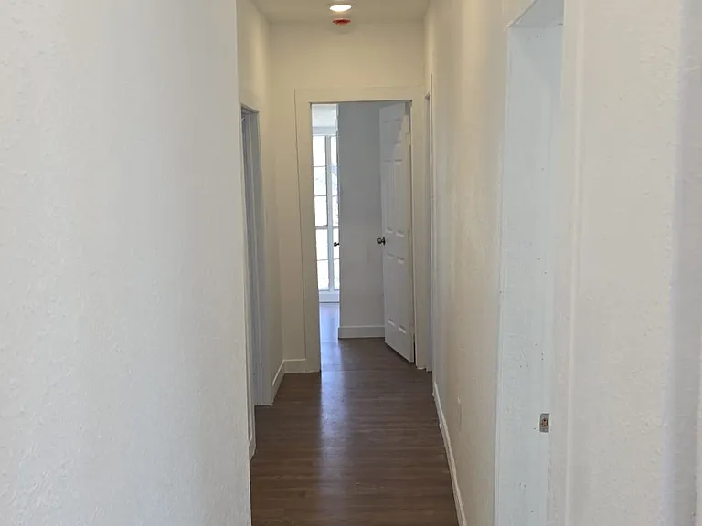 Hallway: on left- 1st & second kids bedroom, on right- master bedroom and kids bathroom, at end- 4th kid's bedroom