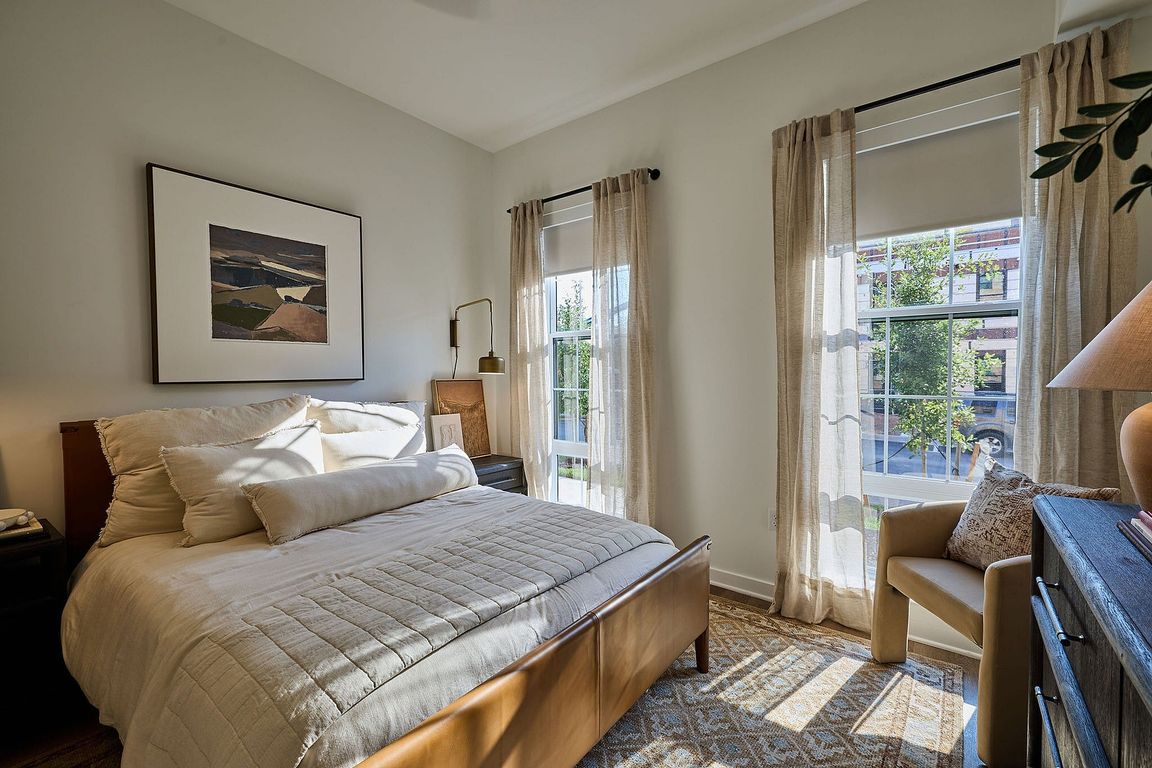 Bright and inviting bedroom with large windows