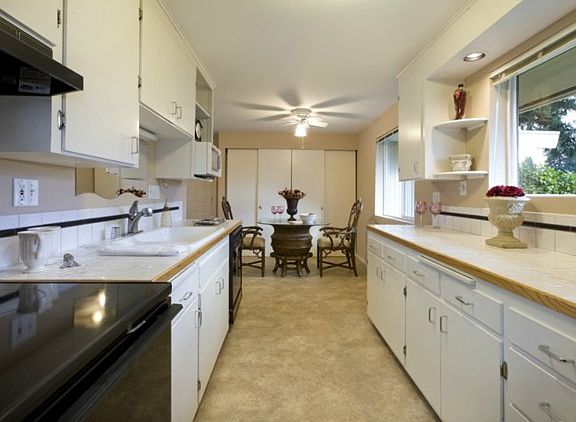 Bright white kitchen with nook and pantry