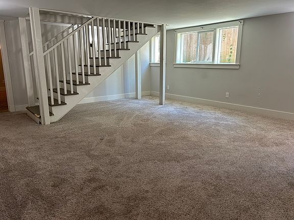 Living Room. Staircase is closed off to upper level - behind the staircase is a great spot for a desk and/or bookcase.