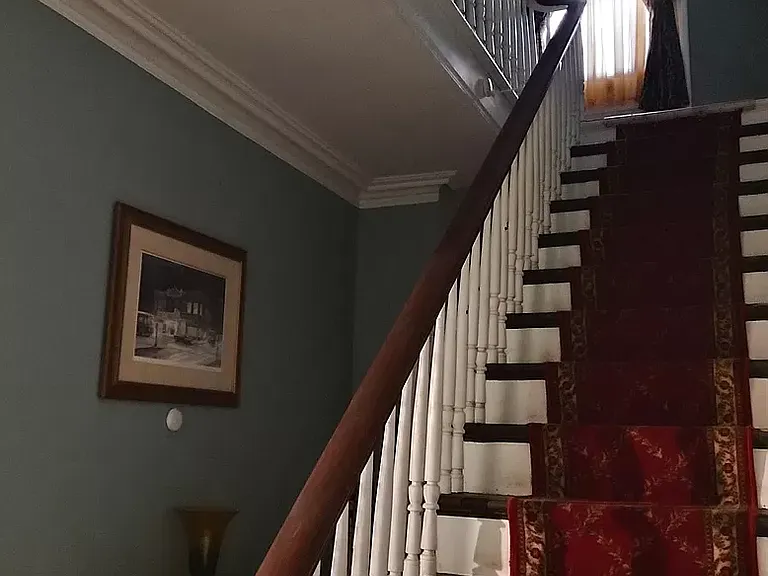 Main hall. Stairs to second floor unit.