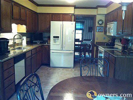 Large eat in kitchen that has bay window