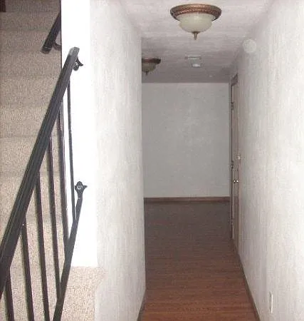 Stairwell to third floor (this condo has two sets of stairs)