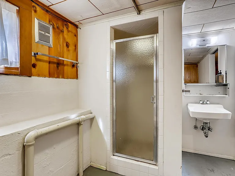 Downstairs bathroom now has new wide plank tile flooring.
