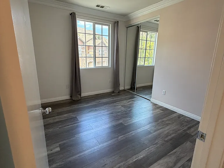 Comfortable second bedroom with spacious closet and beautiful views.