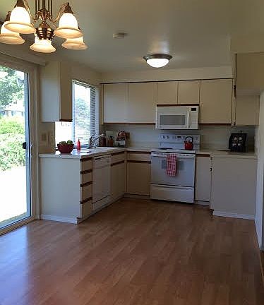 Kitchen (opening to a large backyard with overhang for BBQ)