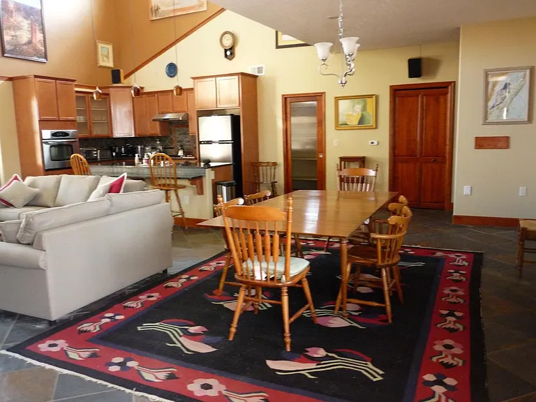 Dining Room with seating for 6 persons. Large pantry behind glass door.